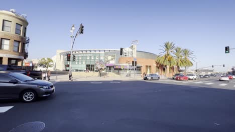 Light-traffic-on-a-clear-and-sunny-day-at-an-intersection-in-Koreatown,-Los-Angeles,-CA