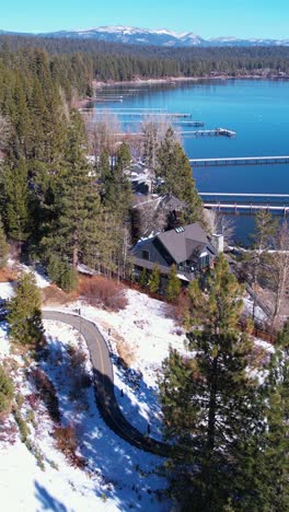 Vertical-Aerial-View,-Lake-Tahoe-on-Sunny-Winter-Day,-Piers-and-Lakefront-Homes,-Drone-Shot