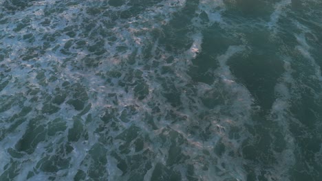 Close-up-aerial-view-of-turbulent-ocean-waves-in-Caxinas,-Vila-do-Conde,-Portugal