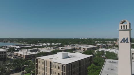 An-aerial-zooming-out-view-of-Houston-Methodist-Clear-Lake-Hospital-under-blue-skies-in-Nassau-Bay,-Texas