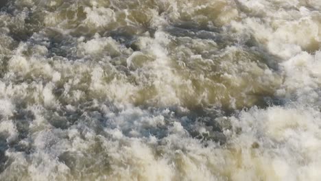 Powerful-waterfall-cascading-with-white-foam-and-rushing-waters-in-Owen-Sound,-Canada