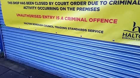 Business-closure-banner-display-on-shop-shutters-from-trading-standards-illegal-criminal-activities