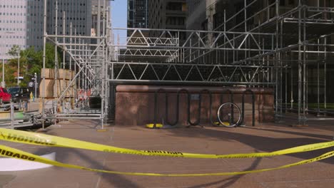 Establishing-shot-of-caution-tape-around-building-that-was-heavily-damaged-after-storm-in-downtown-Houston