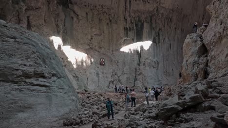 Natural-light-on-cave-chamber-wall-illuminate-Eyes-of-God-Prohodna