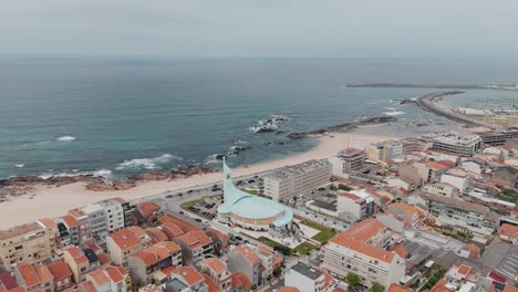 Aerial-view-of-Nossa-Senhora-dos-Navegantes-Church-and-the-coastline-of-Vila-do-Conde,-Portugal