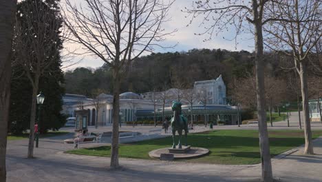 Lockdown-in-Austria---People-enjoy-the-first-warm-spring-day-in-the-park-sitting-on-Park-bench-in-Baden-near-Vienna