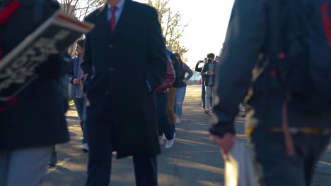 People-walking-in-groups-with-protest-signs