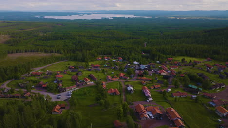 Dolly-right-aerial-view-of-small-Swedish-village