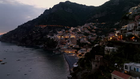 Stunning-aerial-view-of-the-village-of-Positano-on-the-Amalfi-coast-in-Campania,-Italy-during-sunset