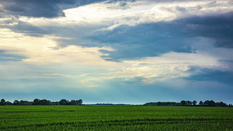 Sun-rays-shining-through-stormy-cloudscape,-time-lapse-view