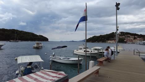 The-tranquil-scenery-of-small-boats-peacefully-floating-in-the-marine-at-Cavtat,-Croatia,-evoking-a-sense-of-serenity-and-coastal-charm