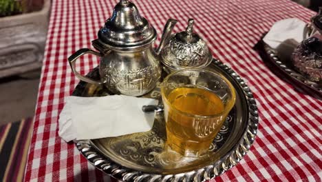 Traditional-Morocco-mint-tea-in-original-metal-tea-set-in-Marrakesh