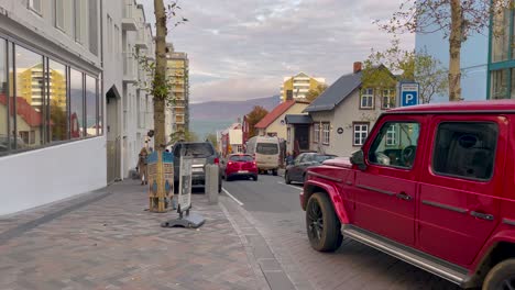 Mountains-and-water-in-background-of-streets-in-central-Reykjavik,-Iceland