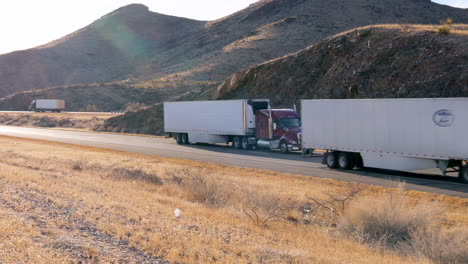 Three-semi-trucks-towing-trailers-full-of-product-across-southwest-Texas