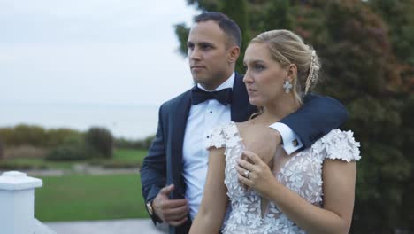 Bride-and-groom-hold-each-other-romantically