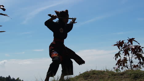 the-silhouette-of-a-young-woman-practicing-martial-arts-on-a-hill-with-a-horse-background