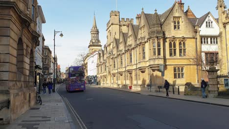 Red-double-decker-public-transport-buses-driving-on-the-streets-in-Oxford-City-in-England-UK