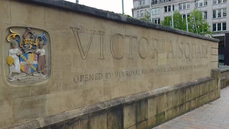 Close-up-of-Victoria-Square-carved-stone-sign-in-popular-tourism-attraction-in-the-city-centre-of-Birmingham,-England-UK