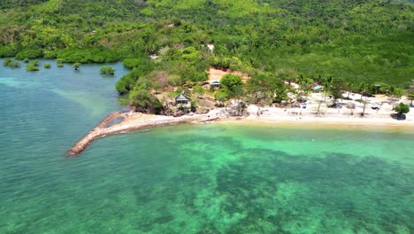 Cabo-Beach-Zooming-Out-Drone-Shot-People-In-Shallow-Water