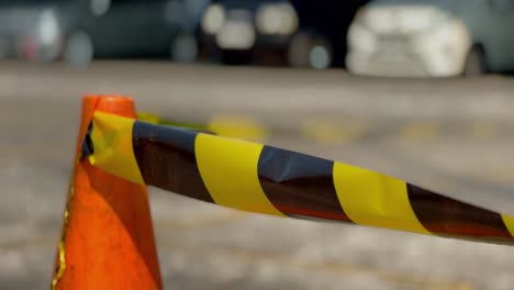 Yellow-black-strip-warning-tape-on-the-parking-lot