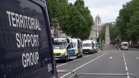 A-dark-blue-Territorial-Support-Group-van-is-parked-in-the-foreground-of-a-line-of-other-white-police-vans-parked-in-front-of-the-Cenotaph-war-memorial-during-a-major-public-event