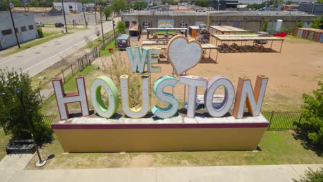 Descending-drone-shot-of-the-'We-Love-Houston'-sign-in-Houston,-Texas