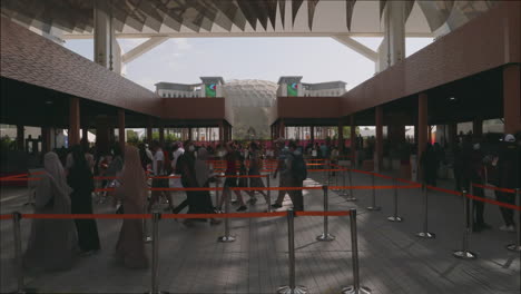 Slow-motion-shot-of-people-moving-in-line-before-entering-the-Dubai-Expo-2020