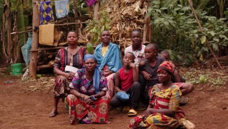 Wide-angle-shot-group-of-black-Africans-sitting-in-rural-countryside