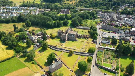 Aerial-Footage-Of-Scottish-Landmark-Melrose-Abbey-In-Melrose,-Scotland,-United-Kingdom