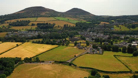 Aerial-pullback-shot-of-small-Scottish-countryside-town-of-Melrose