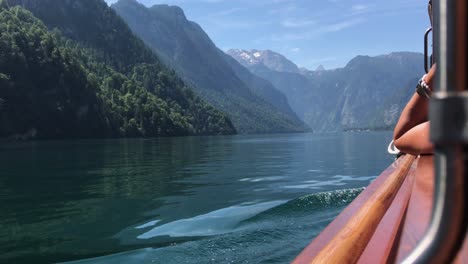 Boat-Side-View-in-Koenigssee-Lake-with-the-Alps-at-the-Background-in-a-Beautiful-Summer-Day,-Germany