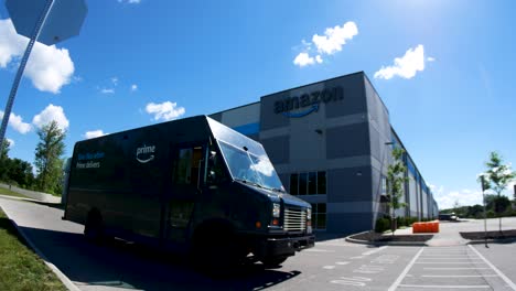 Amazon-van---truck-drives-away-from-Amazon-warehouse-fish-eye-lens