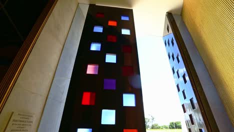 visualizing-the-aluminum-and-colored-glass-door-of-the-Alvorada-Palace-Chapel-against-sunlight