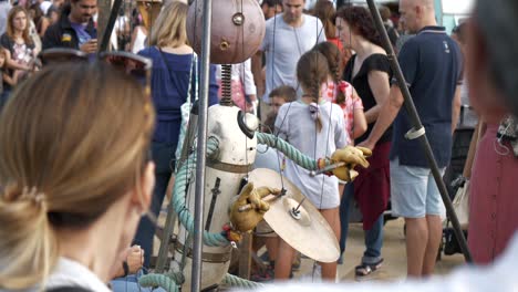 Artistic-puppet-drumming-made-from-recycled-parts---materials-at-global-warming-exhibit