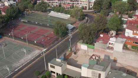 Tilt-Up-Aerial-View-of-La-Salle-Elementary-School-and-Sport-Fields-in-Boulevares,-State-of-Mexico