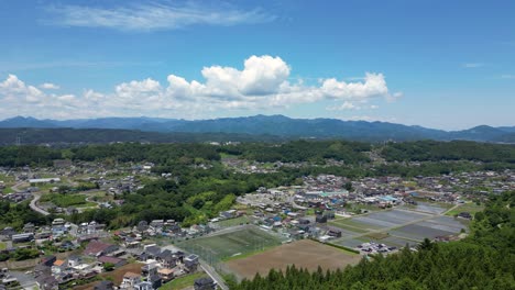 Slow-aerial-pan-over-beautiful-rural-Japanese-landscape-scenery