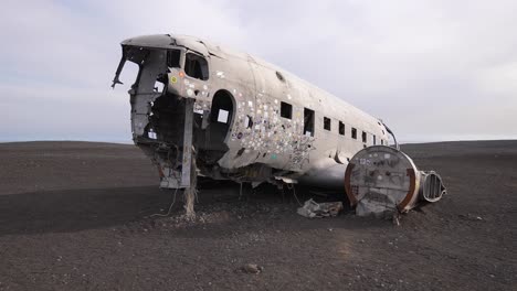 Remains-of-Plane-Wreck-on-Coast-of-Iceland,-US-Navy-Airplane-in-Decay,-Touristic-Attraction