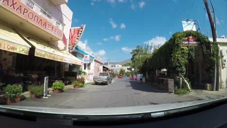 Beautiful-small-town-and-narrow-streets-of-Crete,-driving-POV-view