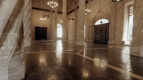 Twisted-columns-restored-main-hall-Llotja-de-la-Seda-Gothic-Medieval-style-building-tour-in-Valencia-Spain-wide-steady-cam-shot