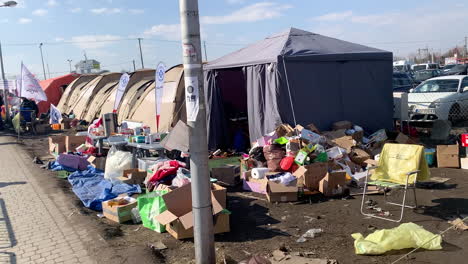 Refugee-camp-for-Ukrainians-escaping-the-war-with-Russia---tents,-clothing,-food-and-humanitarian-aid