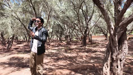 Morocco-Male-guide-explaining-about-the-region-landscape-in-Argan-forest