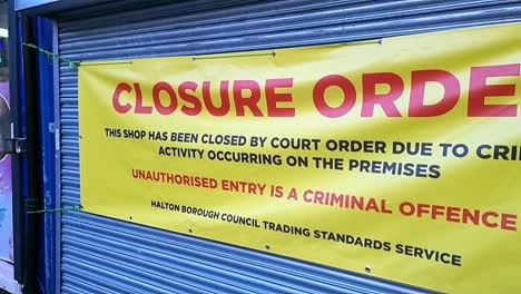 Business-closure-banner-display-on-shop-shutters-from-trading-standards-criminal-illegal-activities