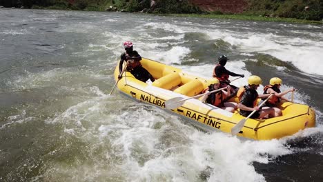 Group-of-people-rafting-"Nalubale"-on-the-Nile-River,-Jinja