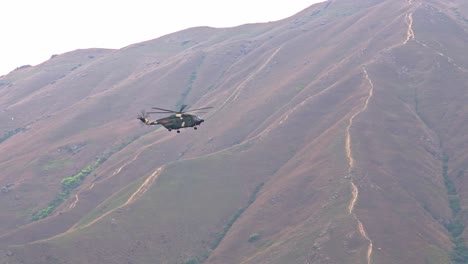 Chinese-People's-Liberation-Army-Z-20-Helicopter-from-Shek-Kong-Garrison-Base-in-Flight-Landing-in-Hong-Kong-Mountains