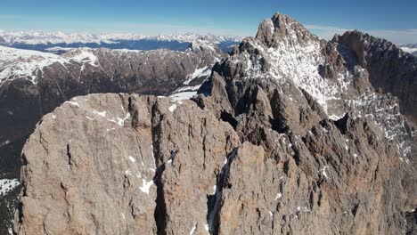 Aerial-View-of-Seceda-Mountains-Ridgeline,-Italian-Dolomites-on-Sunny-Spring-Day,-Drone-Shot