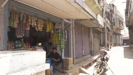 Most-shops-closed-except-a-grocery-store-due-to-the-corona-virus-lockdown-in-a-Rural-Town-of-Bihar,-India