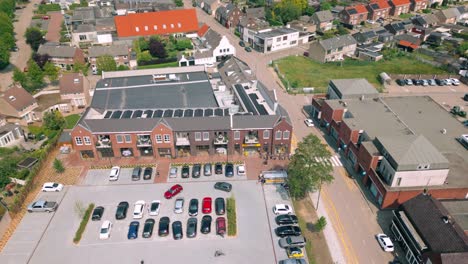 Aerial-view-of-the-parking-lot-and-new-shopping-mall-in-Budel-village,-Cranendonck