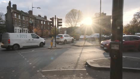 Sun-shining-on-to-congested-London-roundabout-as-cyclists-pass-freely