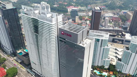 High-angle-Aerial-view-of-CIMB-Bank-tower,-Kuala-Lumpur,-Malaysia