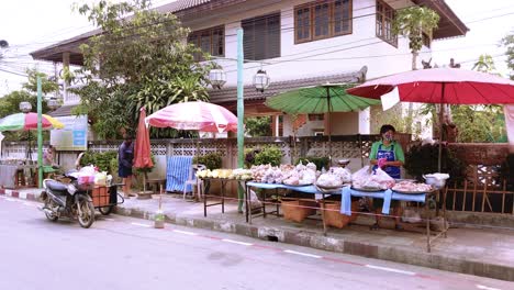 Shot-of-Thai-Lady-Wearing-a-Face-Mask-and-Setting-Up-Her-Food-Stand-During-Coronavirus-Outbreak-In-Bangkok-Thailand